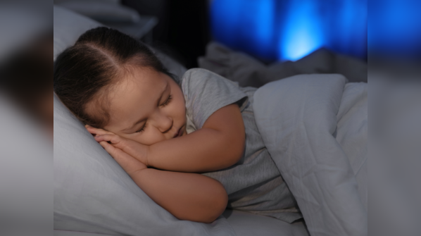 Child sleeping soundly in bed